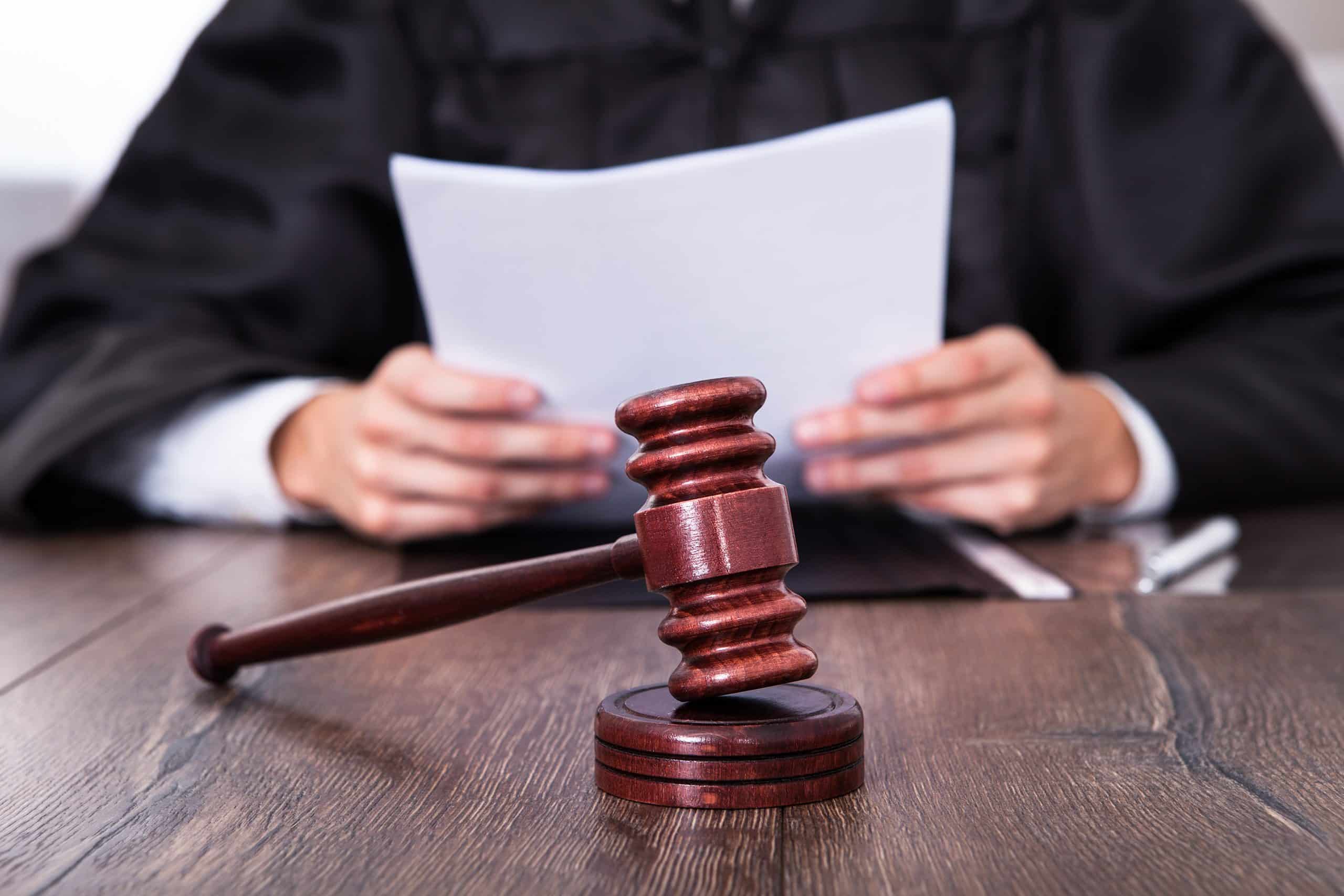 Judge with a gavel at a court date.